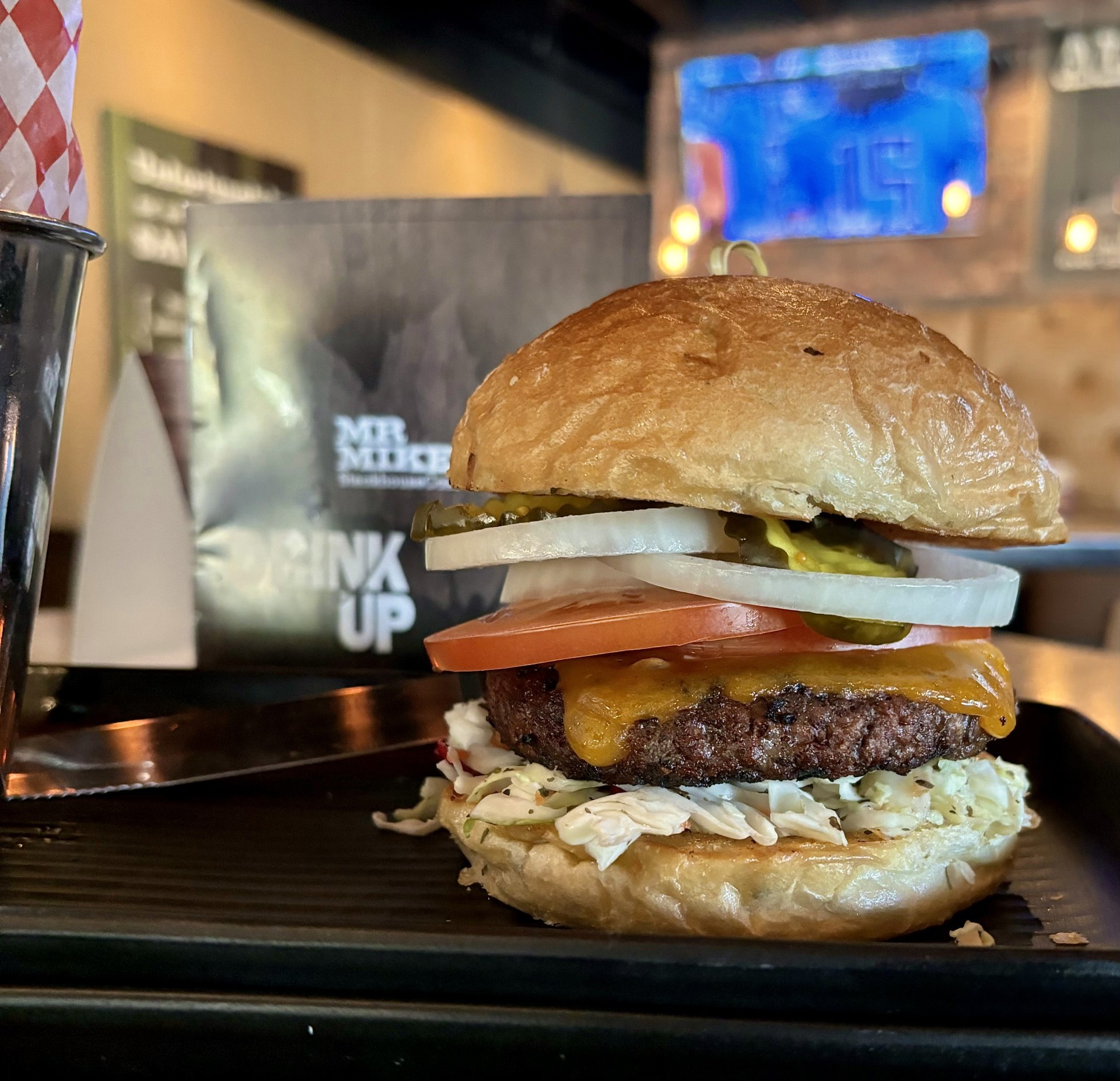 A beef burger with a six-ounce chuck patty with our signature Cajun blackening spice. Served atop a bed of herbed honey-lemon coleslaw, fresh tomatoes, crisp onions, and sweet pickles, all nestled in a toasted potato onion bun.